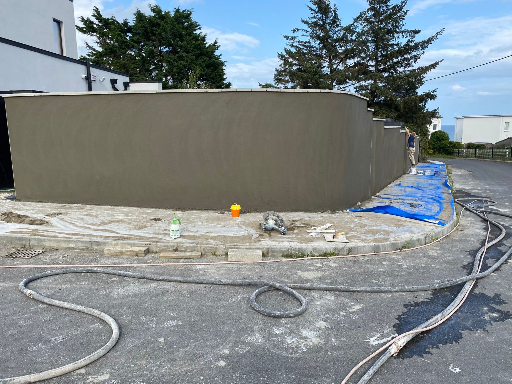 Curved boundary wall render - plastering services Monaghan